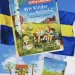 Astrid Lindgrens "Wir Kinder aus Bullerbü" zeigt eine Weise unter blauem Himmel auf der 6 der Kinder im Zeichentrick Stil unter blauem Himmel sitzen.
